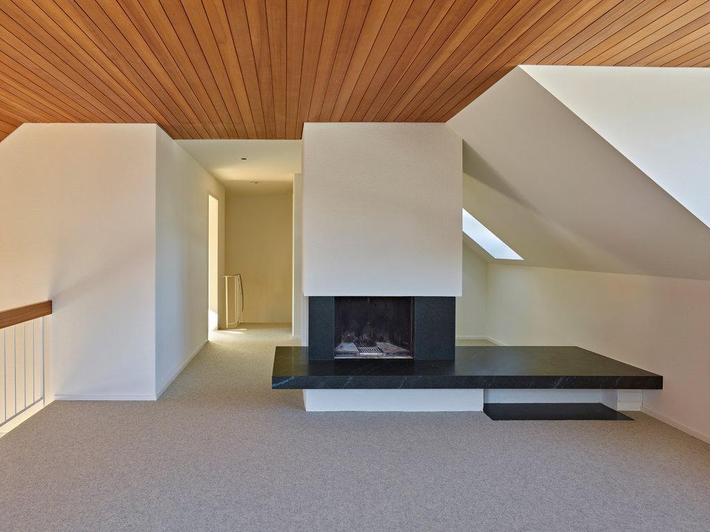 Hilbert architektur Projekt Leimgrubenweg Wohnzimmer mit Kamin